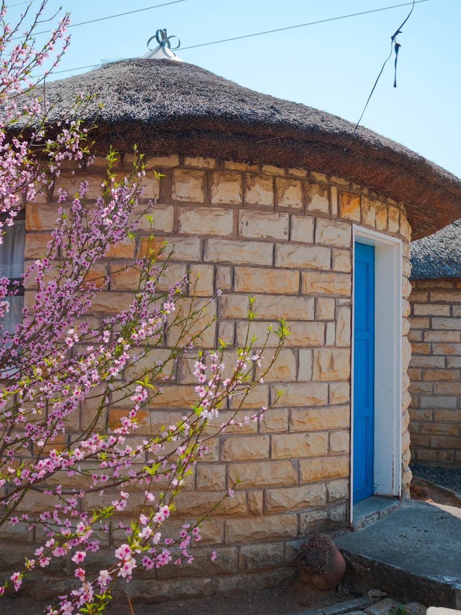 Sandstone rondavel treatment huts at Glorious Beauty Spa, Hlotse